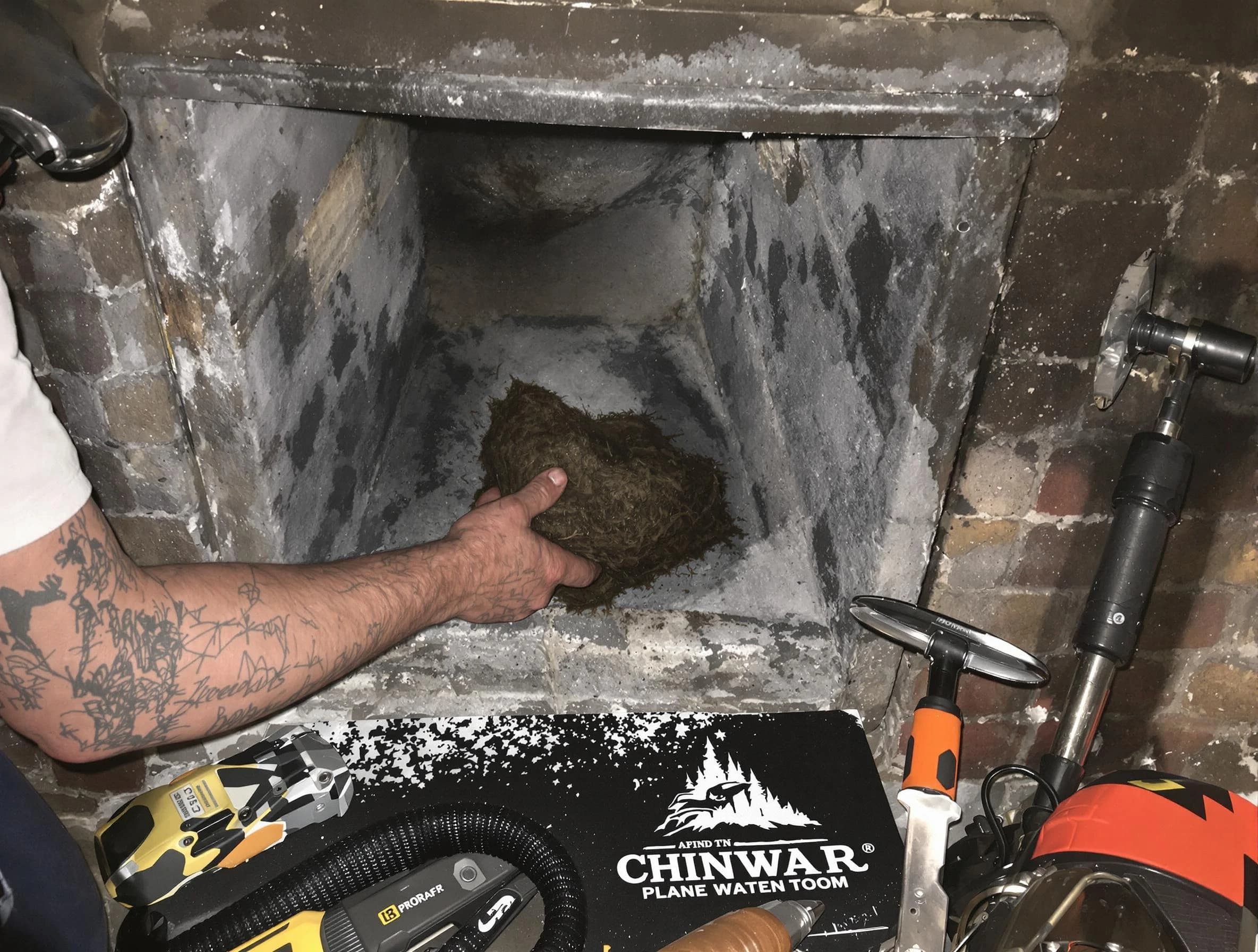 Ridgewood Chimney Sweep safely removing debris and screening chimney in Ridgewood, NJ